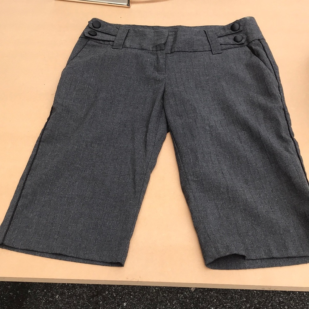 Gray Bermuda shorts.